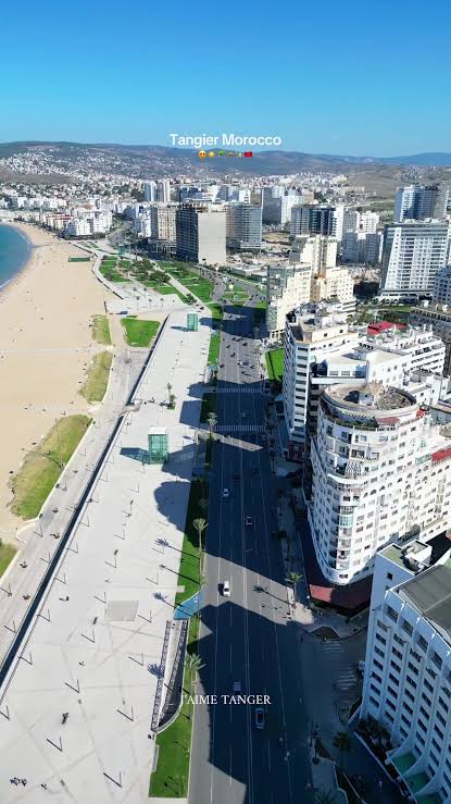 Tangier from above — the city's white buildings descend to the Strait of Gibraltar and Atlantic waters